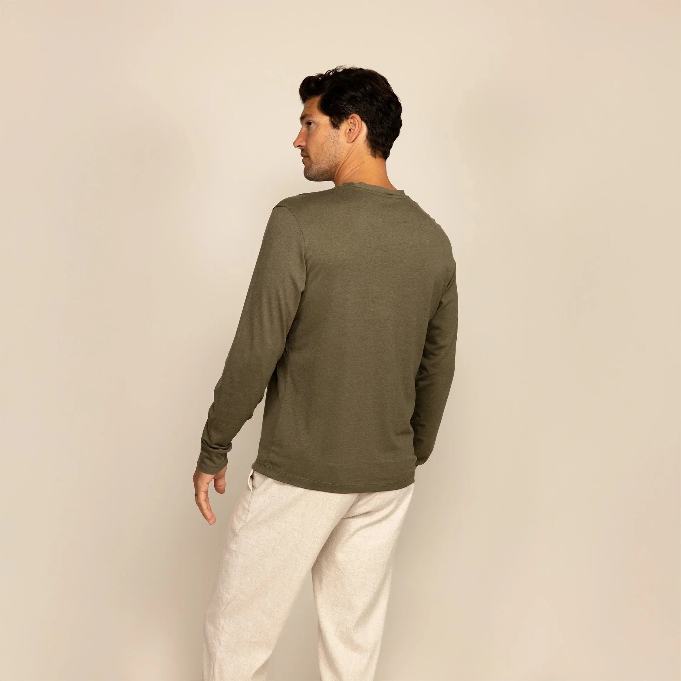 Man wearing a Long Sleeve Lyocell Blend T-Shirt in Olive, rear view. |Olive