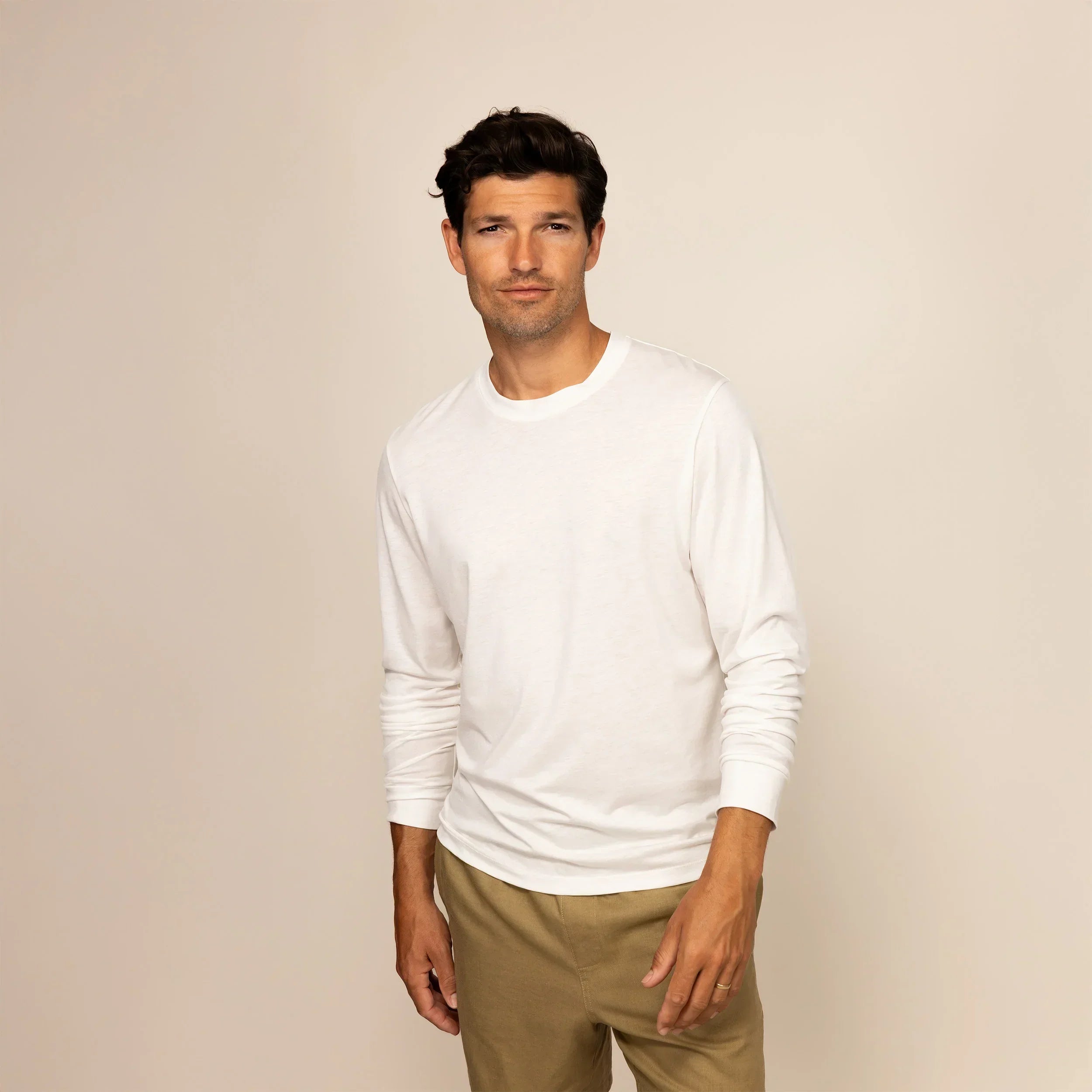 Man wearing a Marame Long Sleeve T-Shirt in White, front view. |White