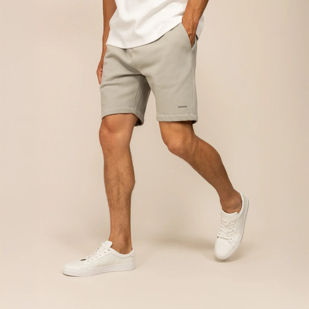 Man wearing Marame Lounge Shorts in Wolf Grey, front view.