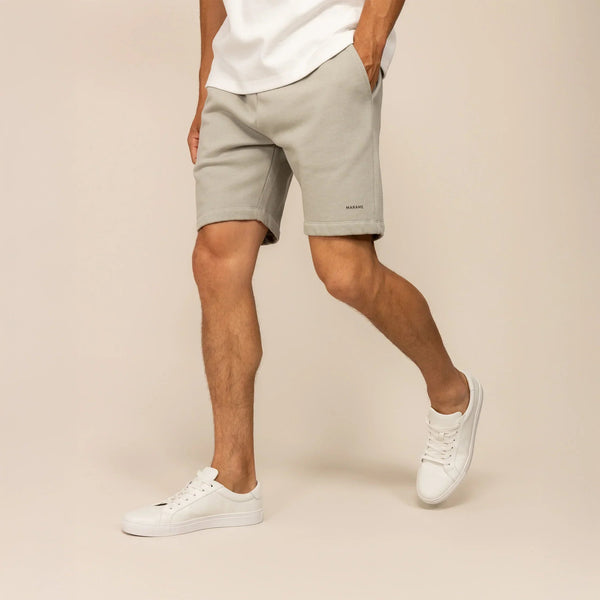 Man wearing Marame Lounge Shorts in Wolf Grey, front view. |Wolf Green