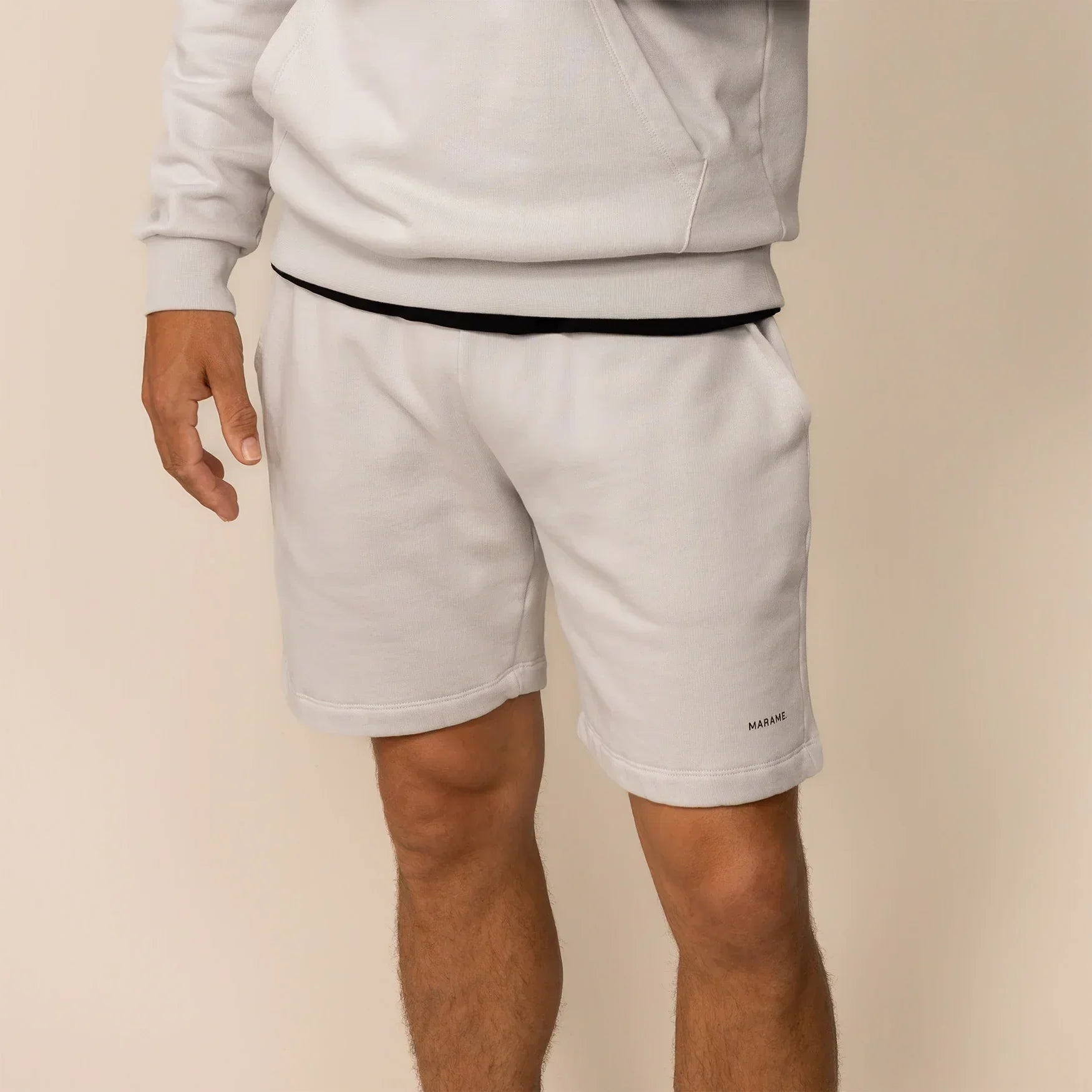 Man wearing Lounge Shorts in Ash White, front view. |ash white