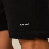 Man wearing Marame Lounge Shorts in Black, closeup. |black