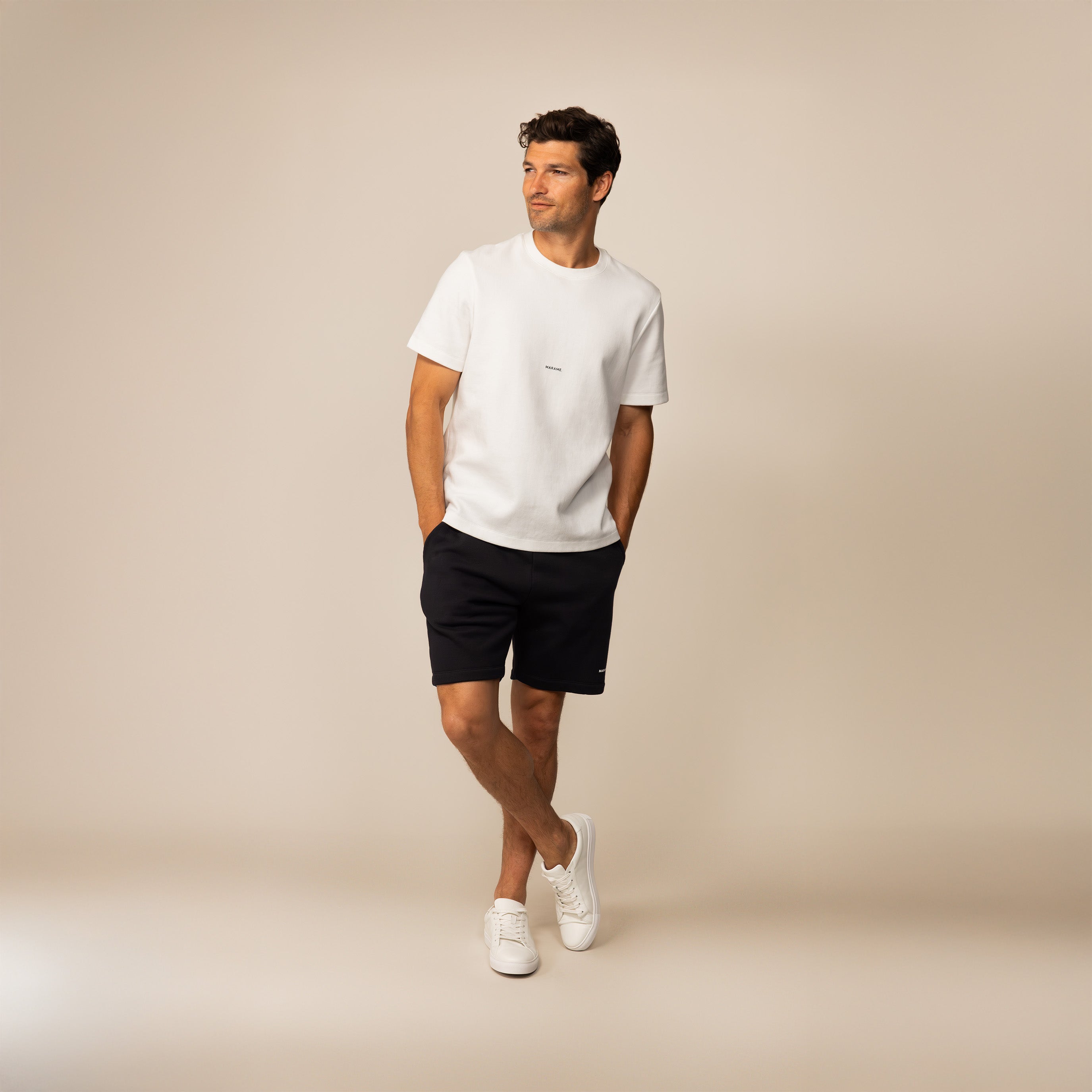 Man wearing Marame Lounge Shorts in Black, front view.