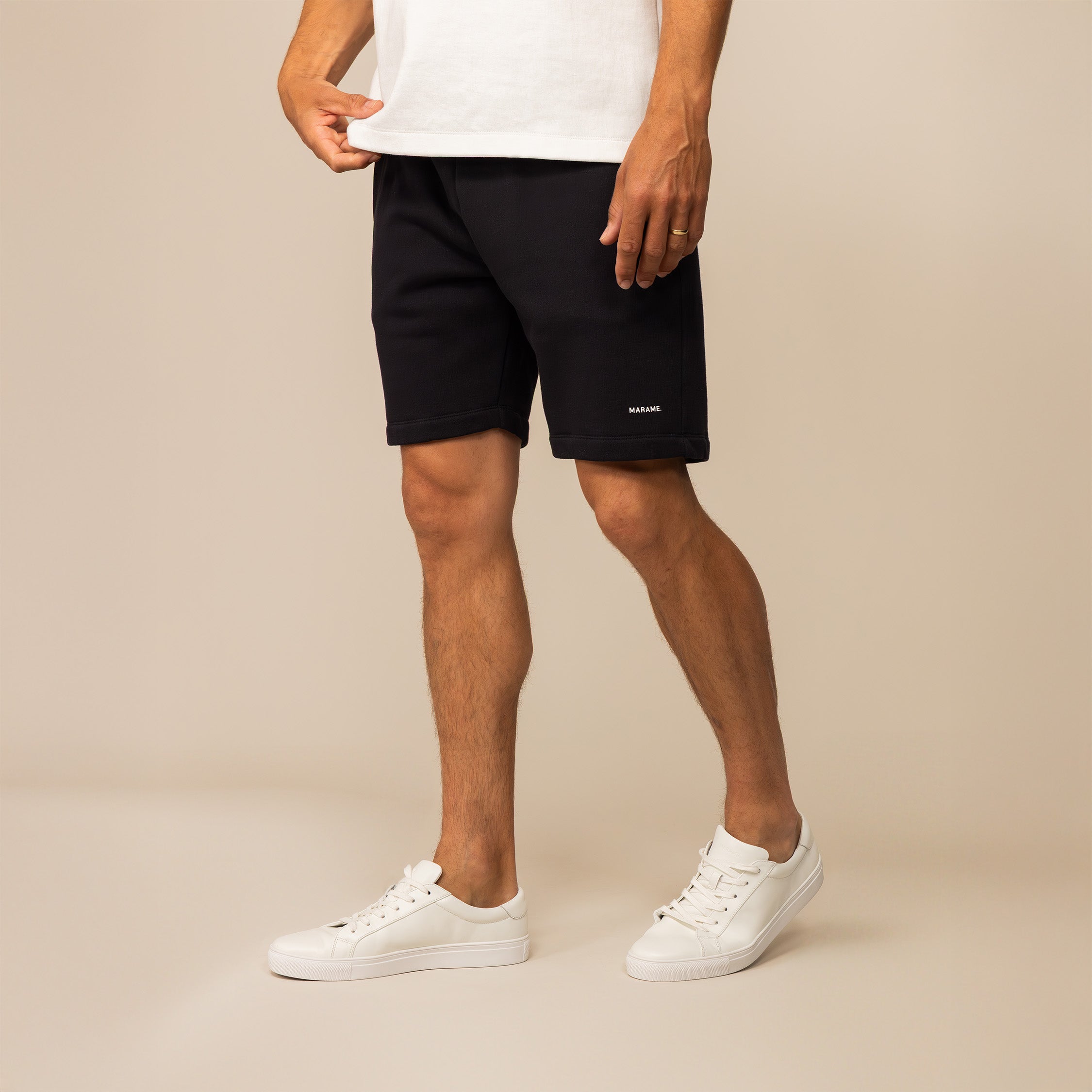 Man wearing Marame Lounge Shorts in Black, front view.