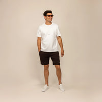 Man wearing Marame Lounge Shorts in Smoked Brown, front view.