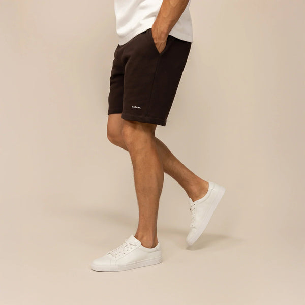 Man wearing Lounge Shorts in Smoked Brown, side view. |smoked brown