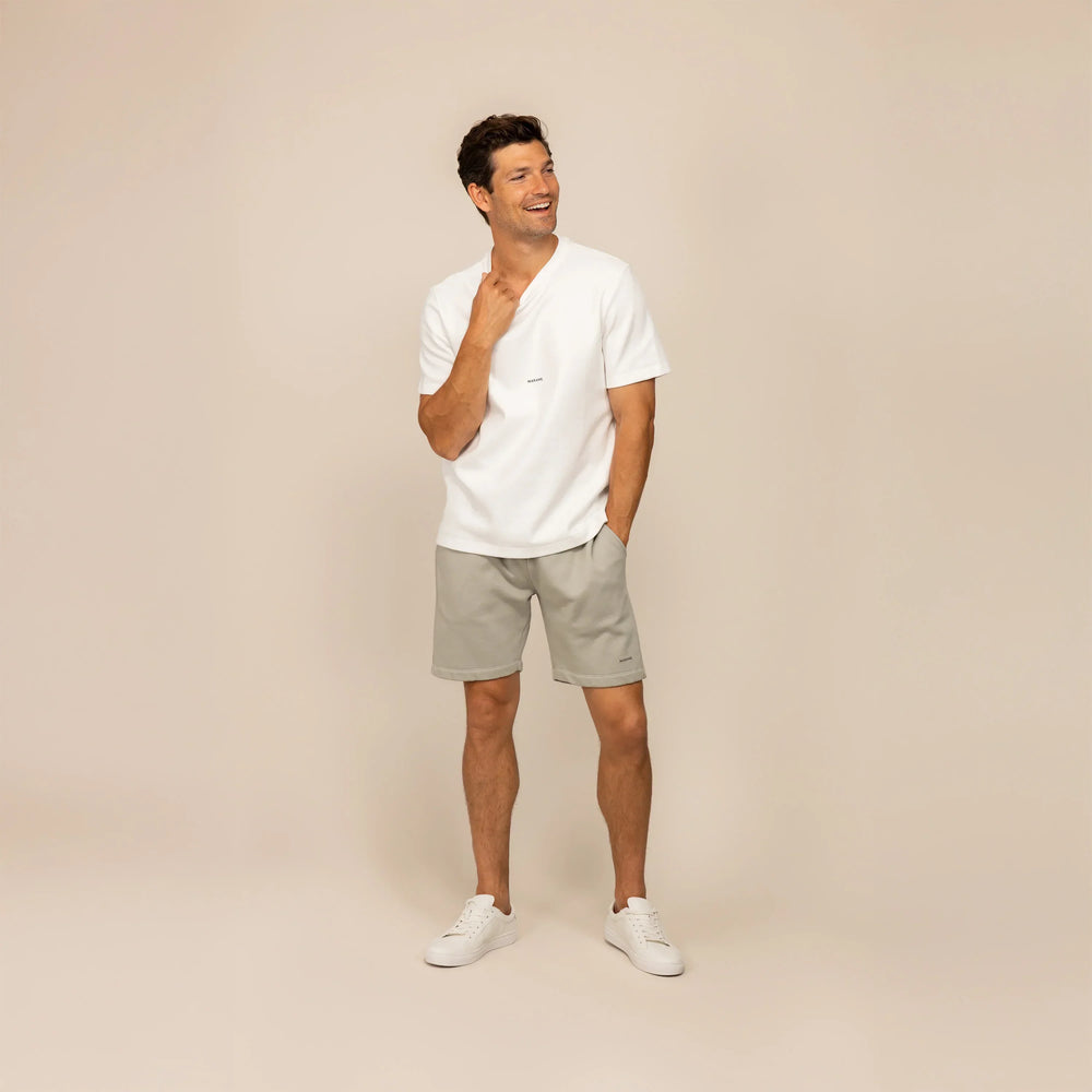 Man wearing Marame Lounge Shorts in Wolf Grey, front view.