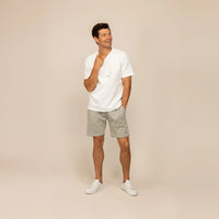 Man wearing Marame Lounge Shorts in Wolf Grey, front view.