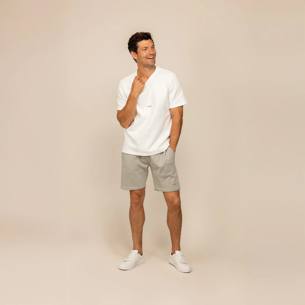 Man wearing Marame Lounge Shorts in Wolf Grey, front view. |Wolf Green