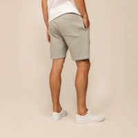 Man wearing Marame Lounge Shorts in Wolf Grey, rear view. |Wolf Green