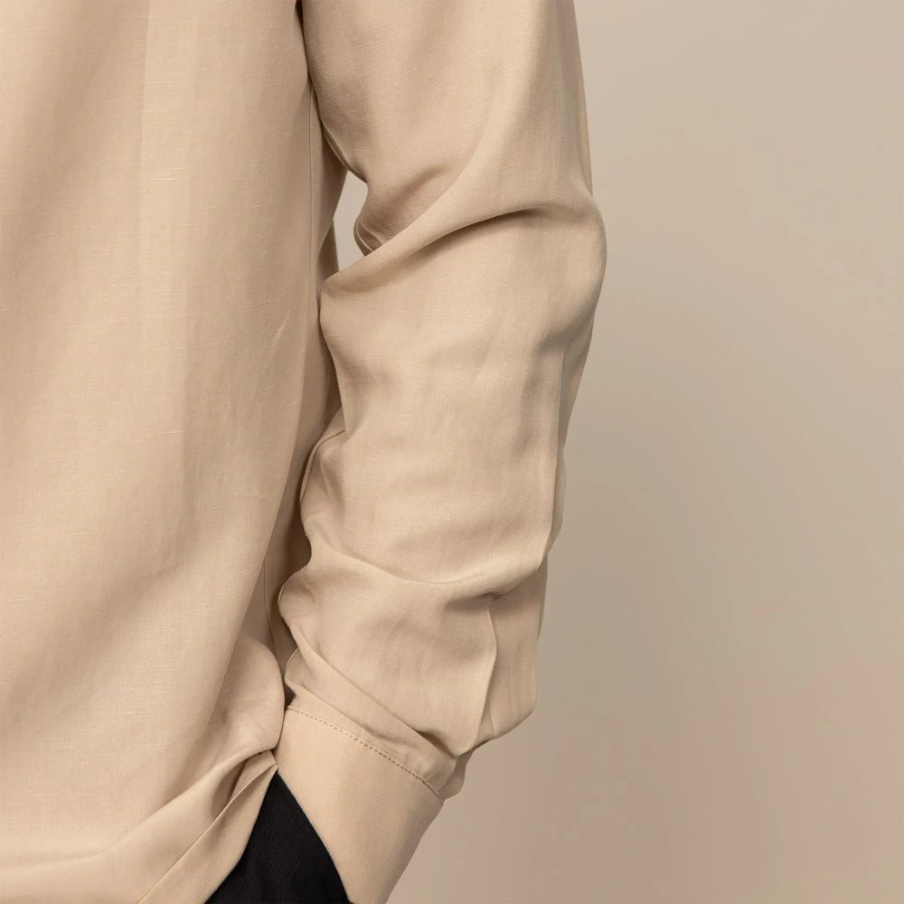 Man wearing Lyocell/Linen Blend Casual Long Sleeve Shirt in Drift Beige, closeup.