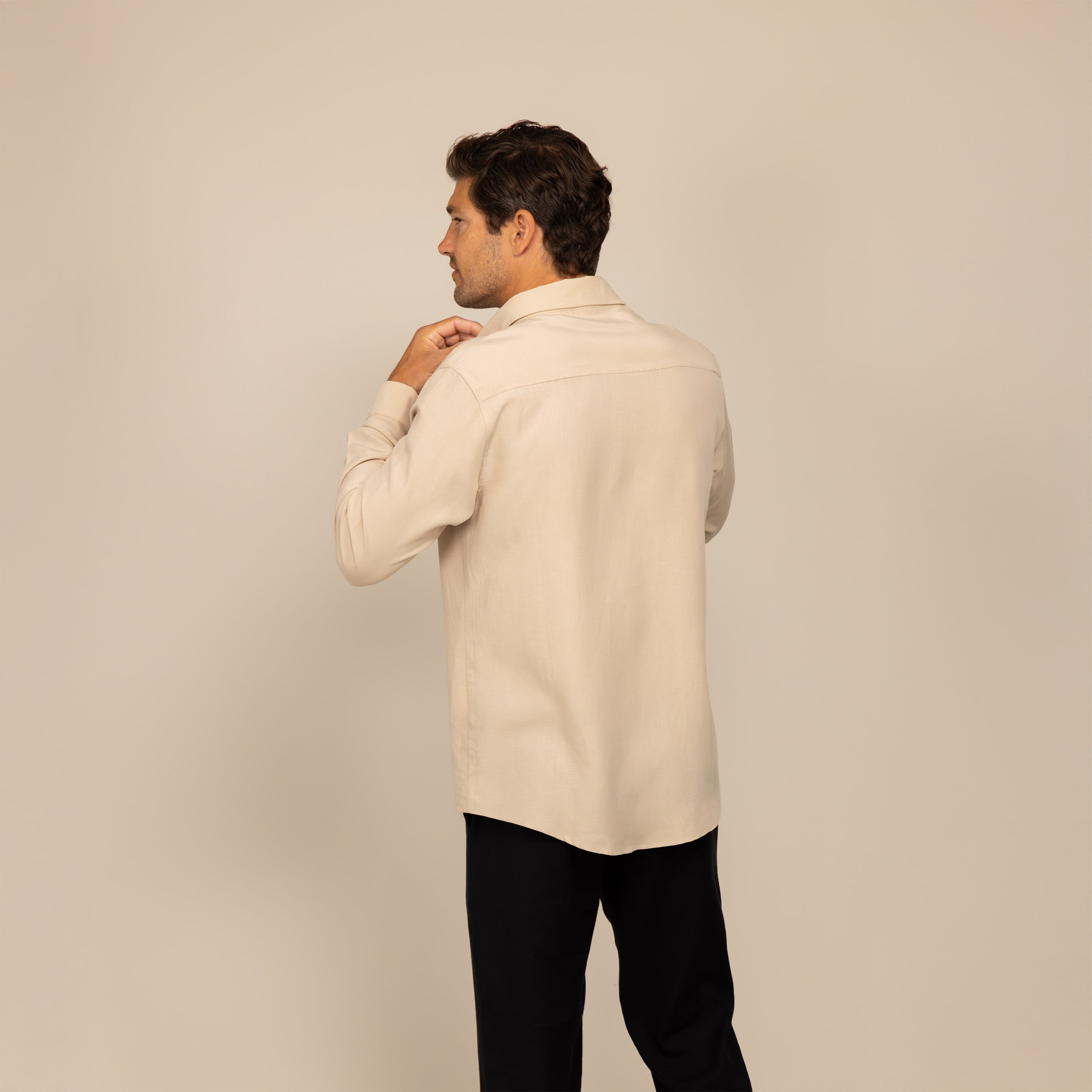 Man wearing Lyocell/Linen Blend Casual Long Sleeve Shirt in Drift Beige, rear view.