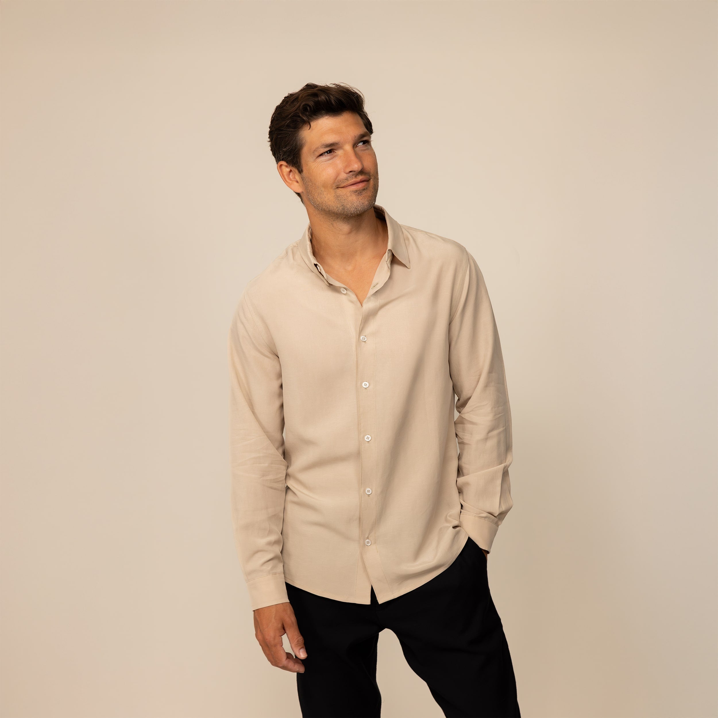 Man wearing Marame Lyocell/Linen Blend Casual Long Sleeve Shirt in Drift Beige, front view.