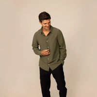 Man wearing Marame Lyocell/Linen Blend Casual Long Sleeve Shirt in Olive Grove, front view.