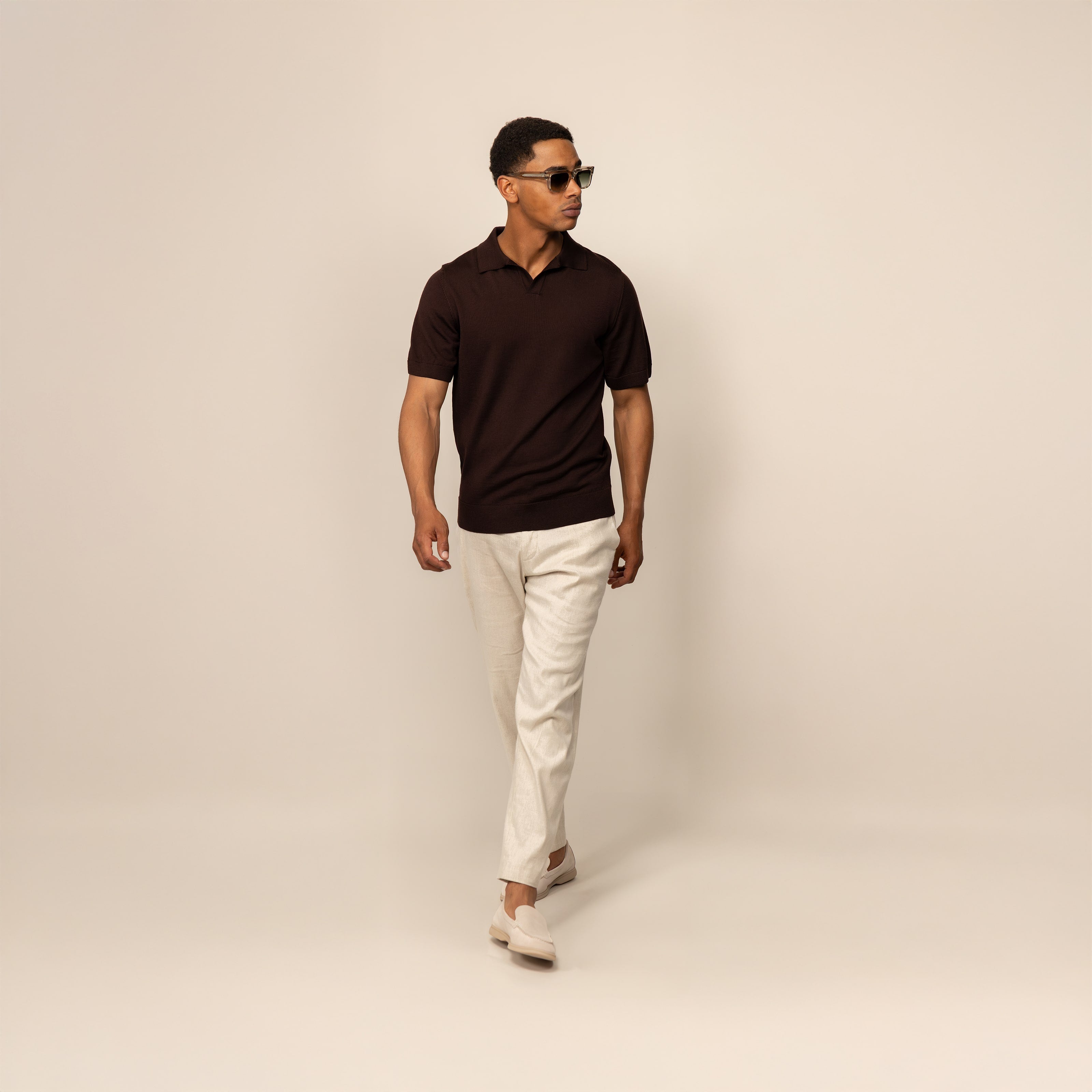 Man wearing a Marame Merino Cotton Open Collar Short Sleeve Polo in Brown Cherry, front view.
