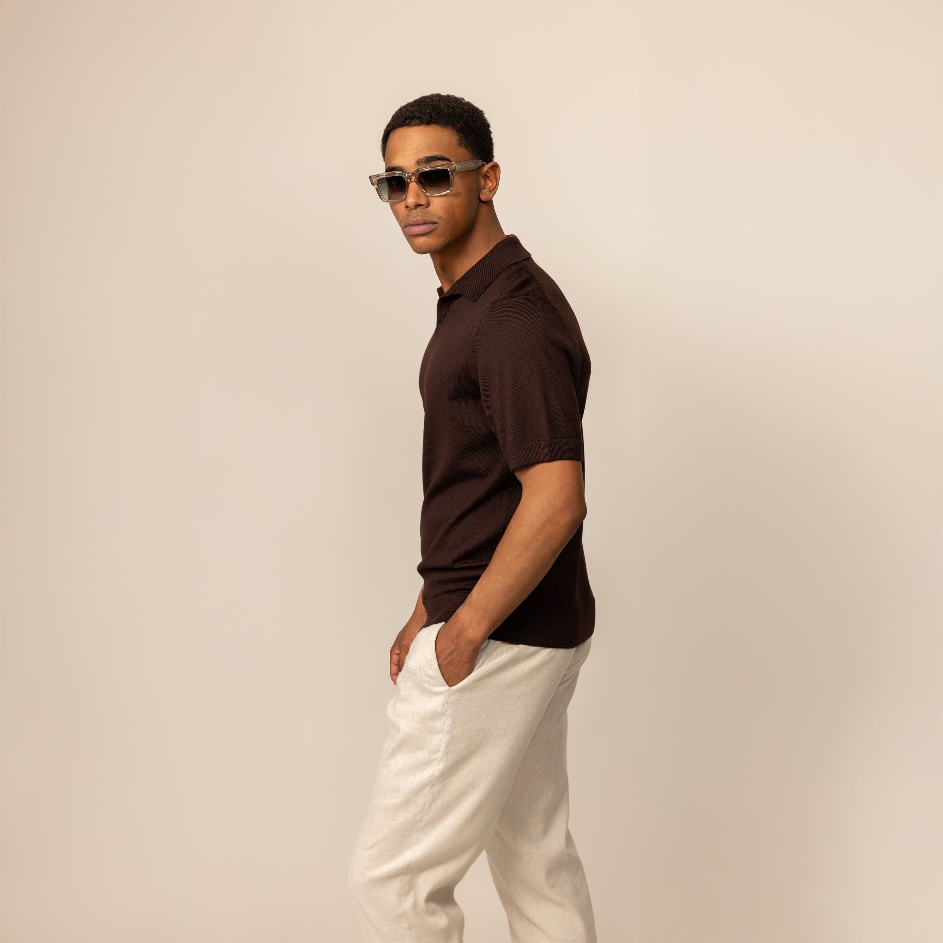 Man wearing a Marame Merino Cotton Open Collar Short Sleeve Polo in Brown Cherry, front view.