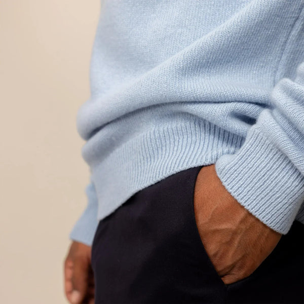 Man wearing a Marame Merino Wool Crew Neck Knit Jumper in Blushing Blue, closeup.|blushing blue