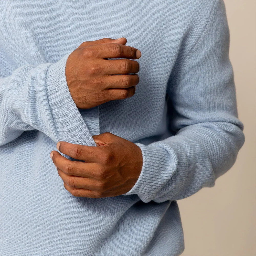 Man wearing a Marame Merino Wool Crew Neck Knit Jumper in Blushing Blue, closeup.|blushing blue
