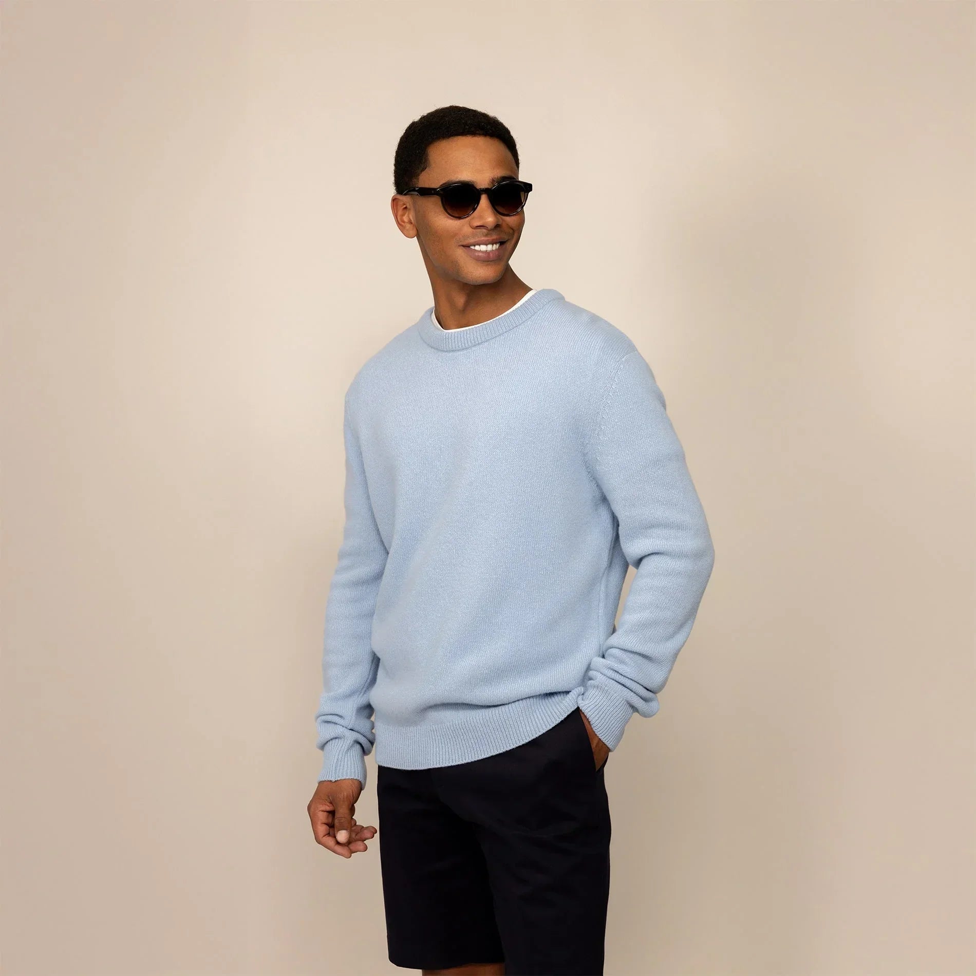 Man wearing a Marame Merino Wool Crew Neck Knit Jumper in Blushing Blue, front view.|blushing blue