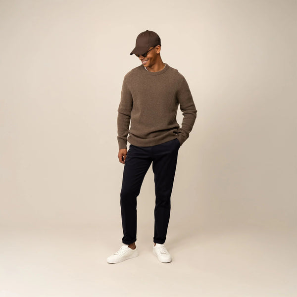 Man wearing a Marame Merino Wool Crew Neck Knit Jumper in wholemeal, front view.|wholemeal