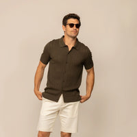 Man wearing morning meadow cable knit short sleeve shirt, front view.