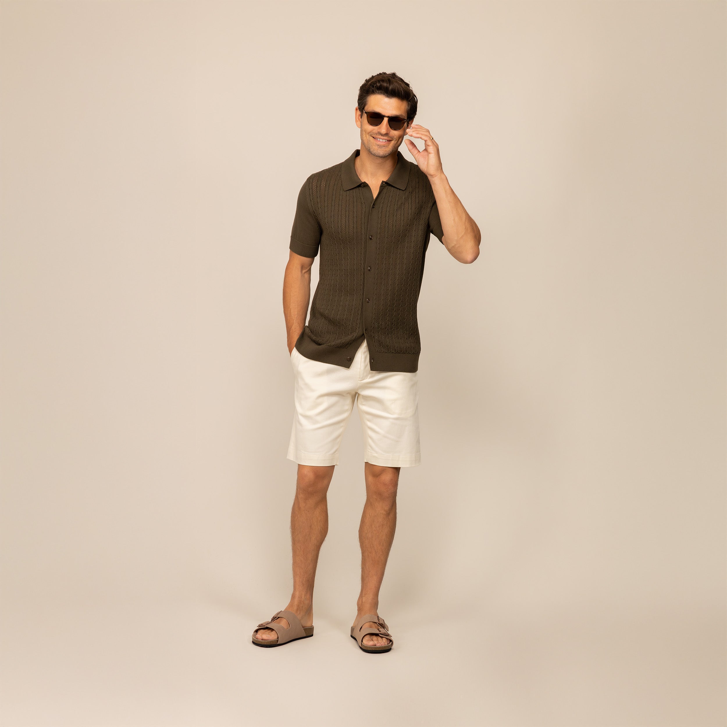 Man wearing morning meadow cable knit short sleeve shirt, front view.