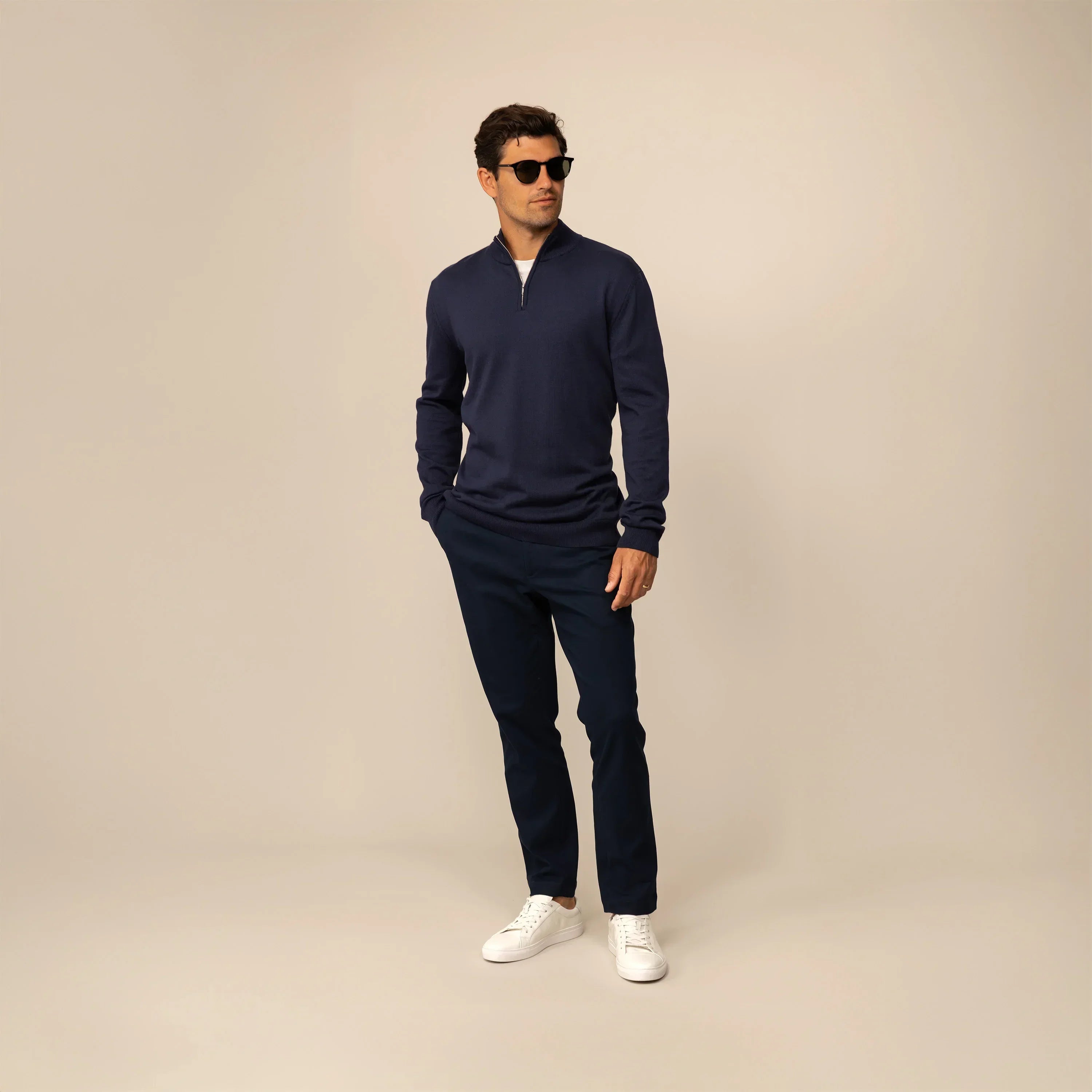 Man wearing a navy half zip jumper, front view. |navy