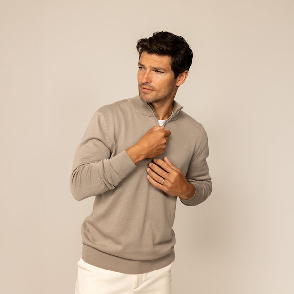 Man wearing a putty dove half zip jumper, front view.