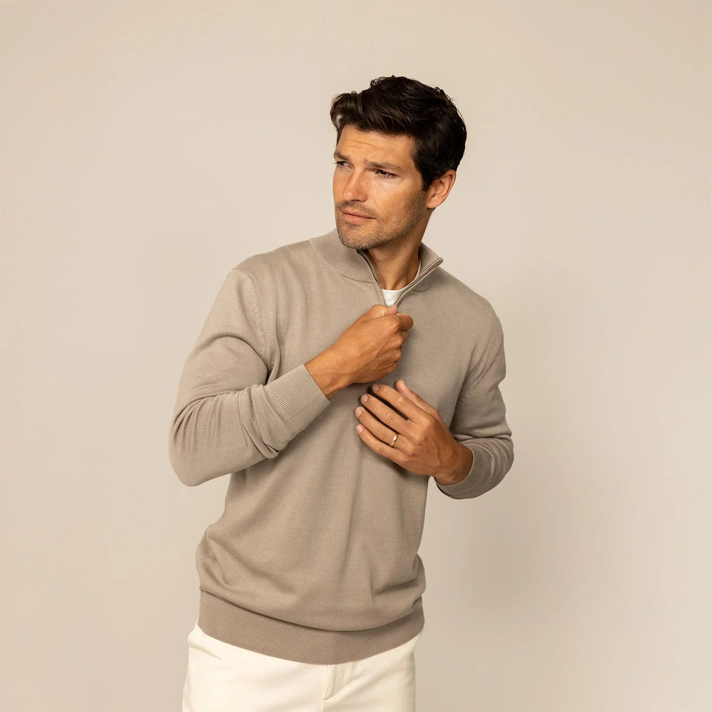 Man wearing a putty dove half zip jumper, front view.