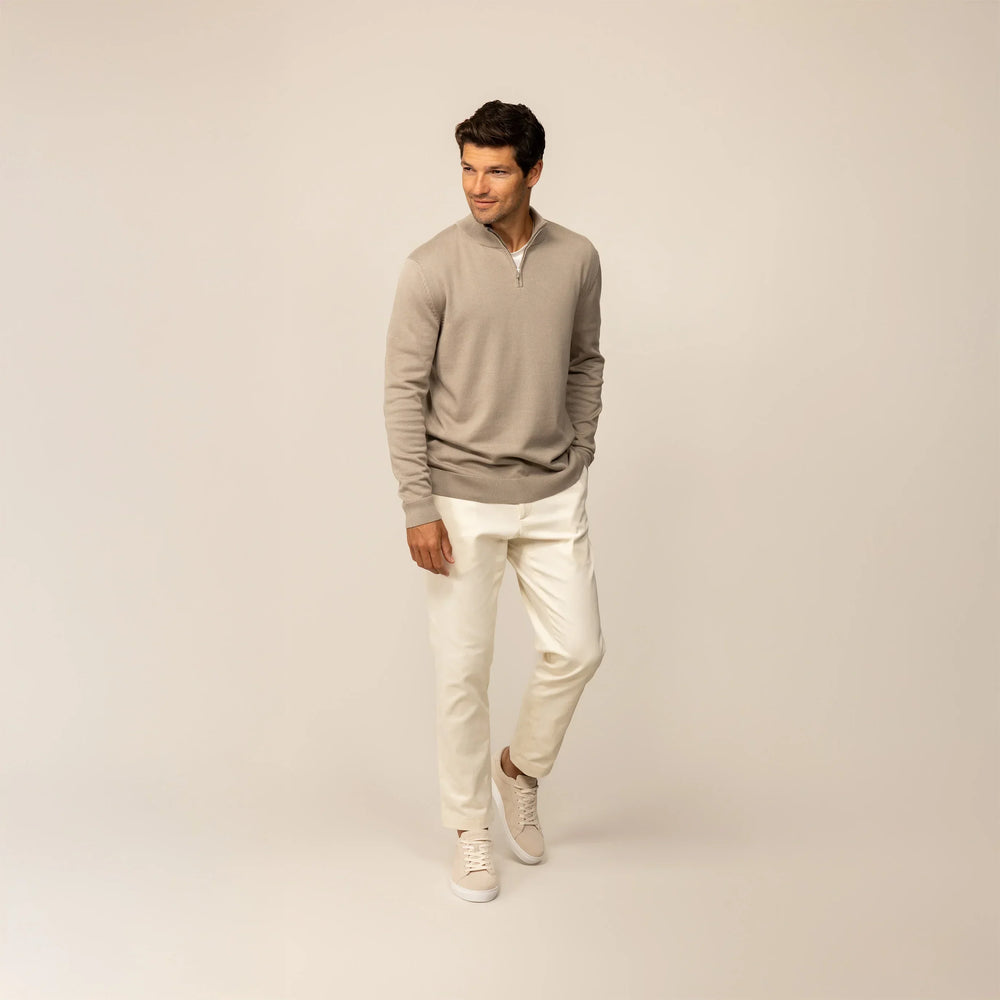 Man wearing a putty dove half zip jumper, front view.