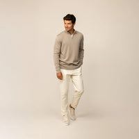 Man wearing a putty dove half zip jumper, front view.