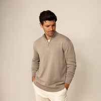 Man wearing a putty dove half zip jumper, front view.