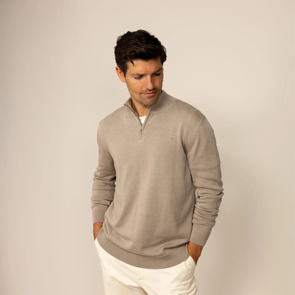 Man wearing a putty dove half zip jumper, front view. |putty dove