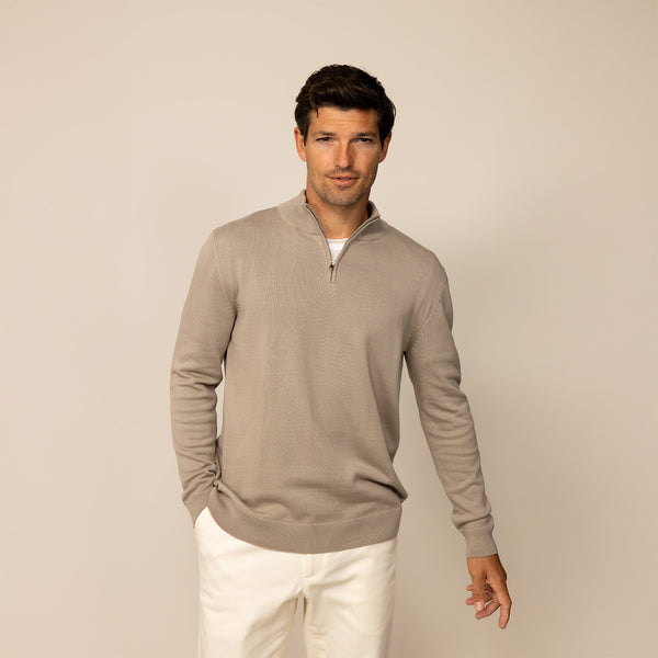 Man wearing a putty dove half zip jumper, front view.