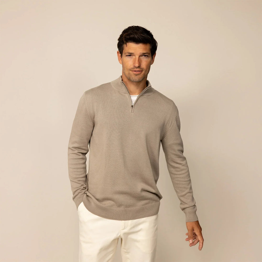 Man wearing a putty dove half zip jumper, front view.
