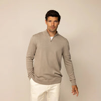Man wearing a putty dove half zip jumper, front view.