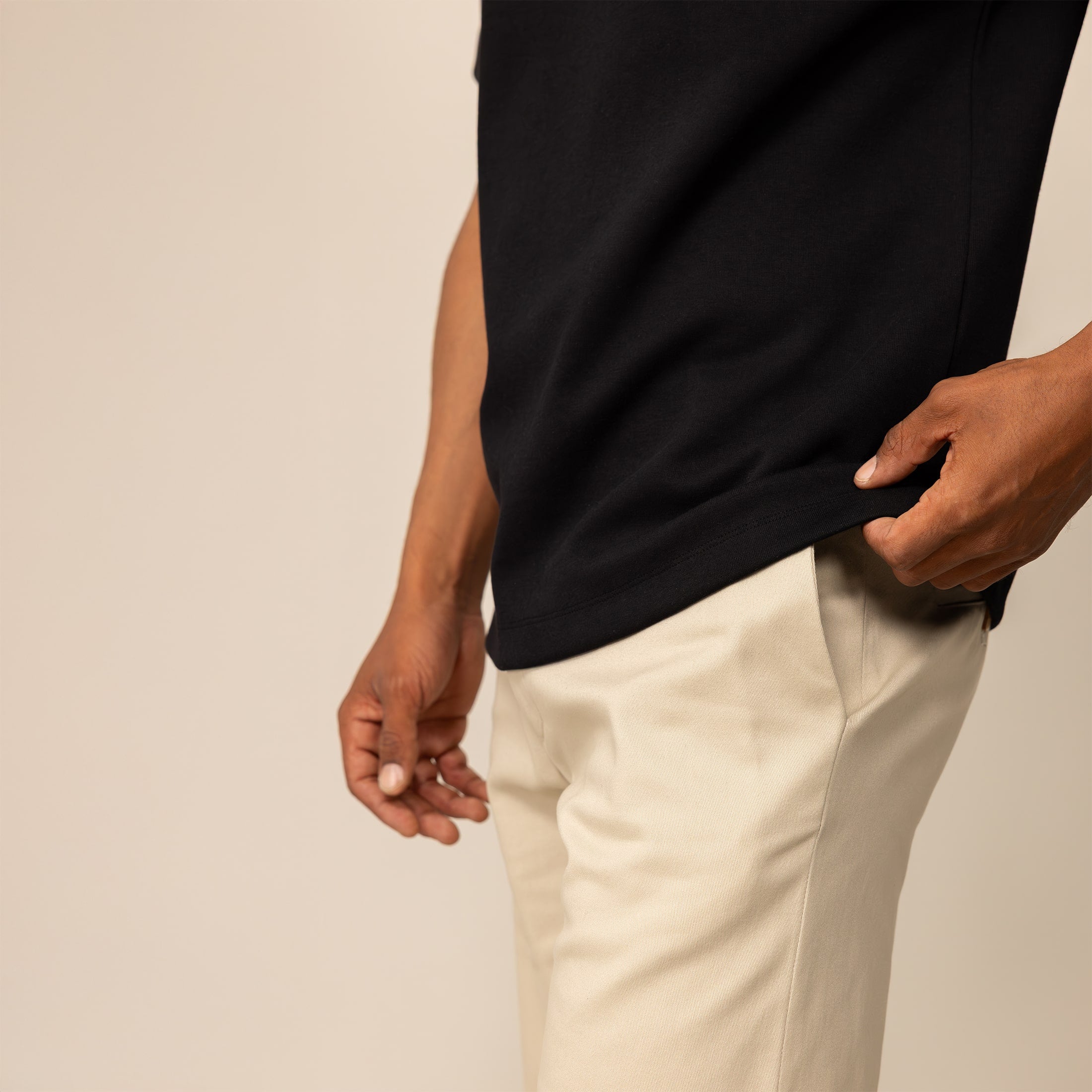 Man wearing a Marame Relaxed Fit Logo T-Shirt in Black, closeup.
