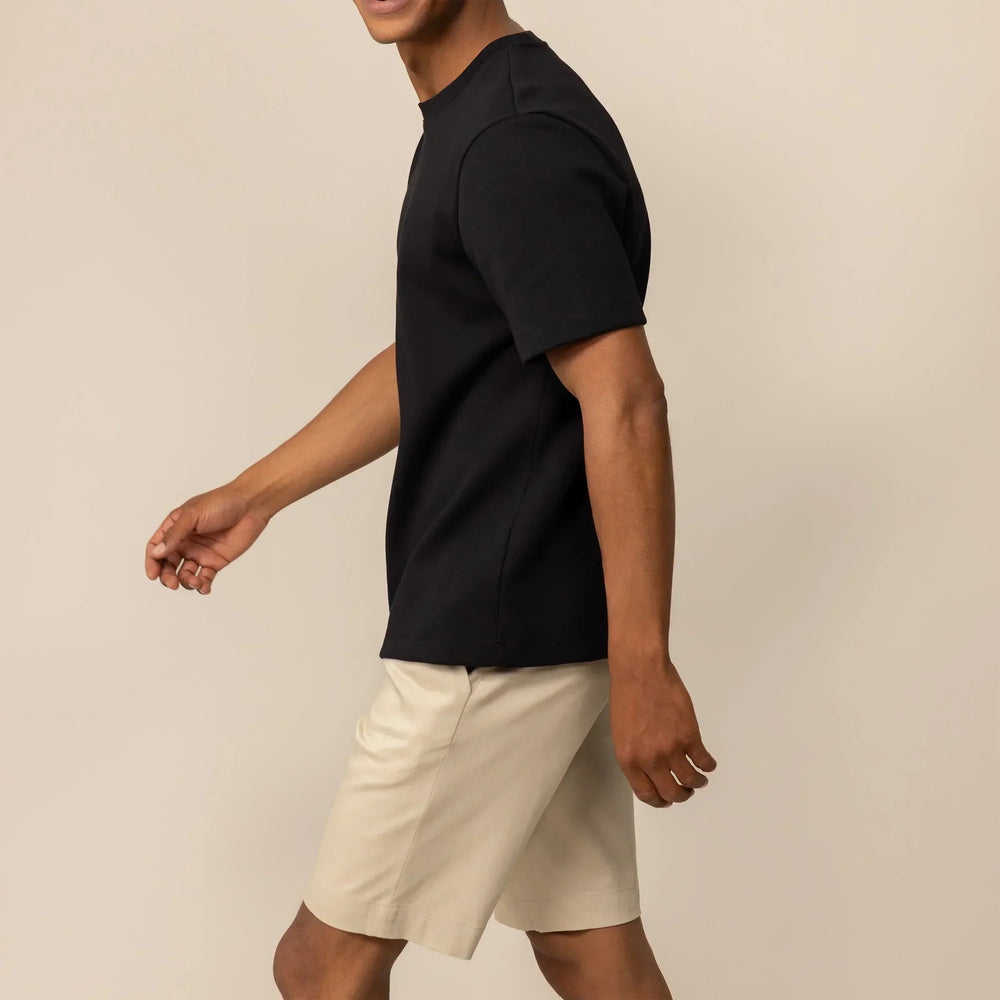 Man wearing a Marame Relaxed Fit Logo T-Shirt in Black, front view. |Black