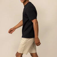 Man wearing a Marame Relaxed Fit Logo T-Shirt in Black, front view. |Black