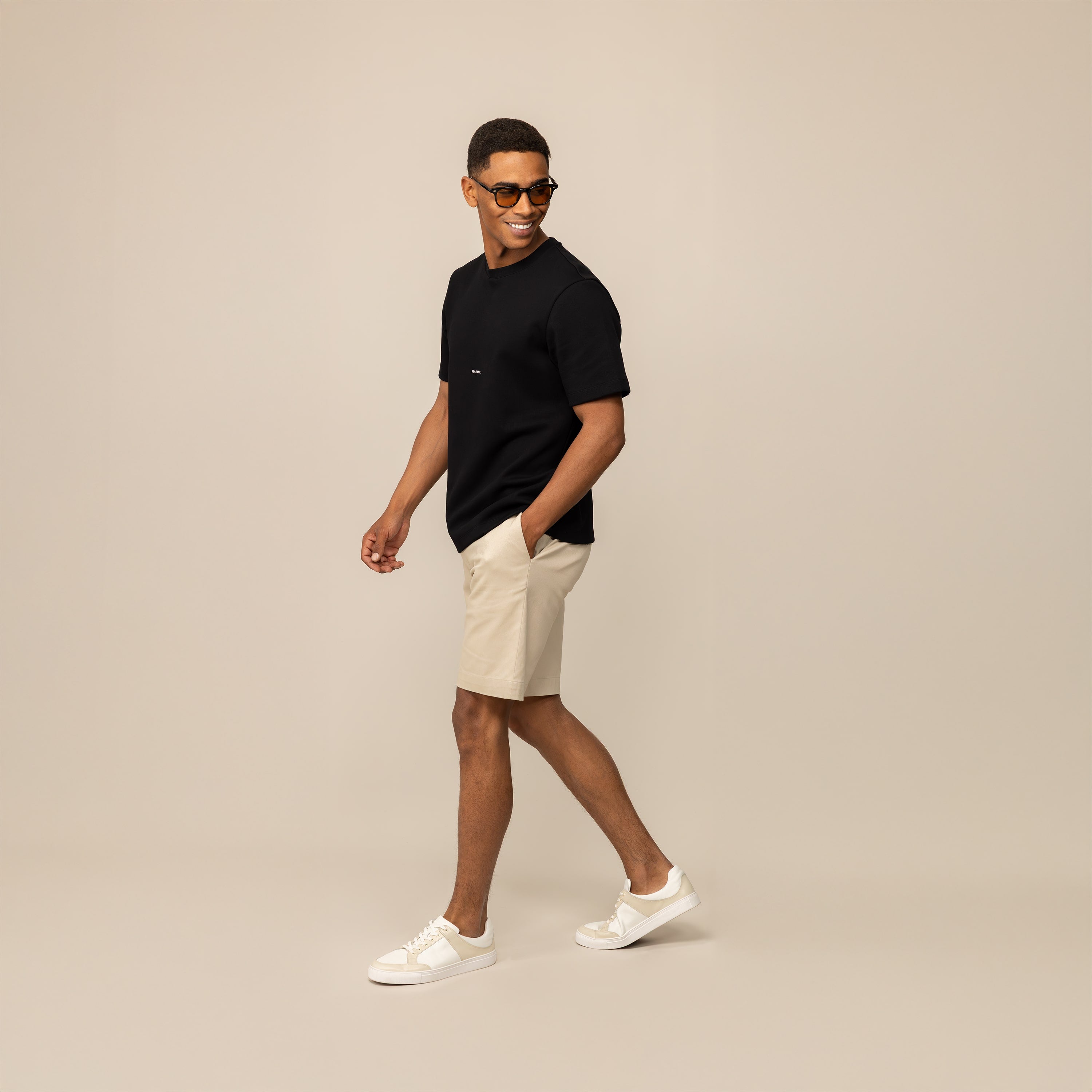 Man wearing a Marame Relaxed Fit Logo T-Shirt in Black, front view.