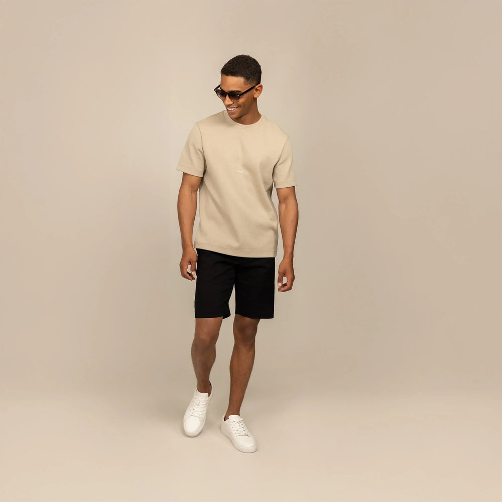 Man wearing a Marame Relaxed Fit T-Shirt in Canyon Clay, front view.