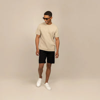 Man wearing a Marame Relaxed Fit T-Shirt in Canyon Clay, front view.