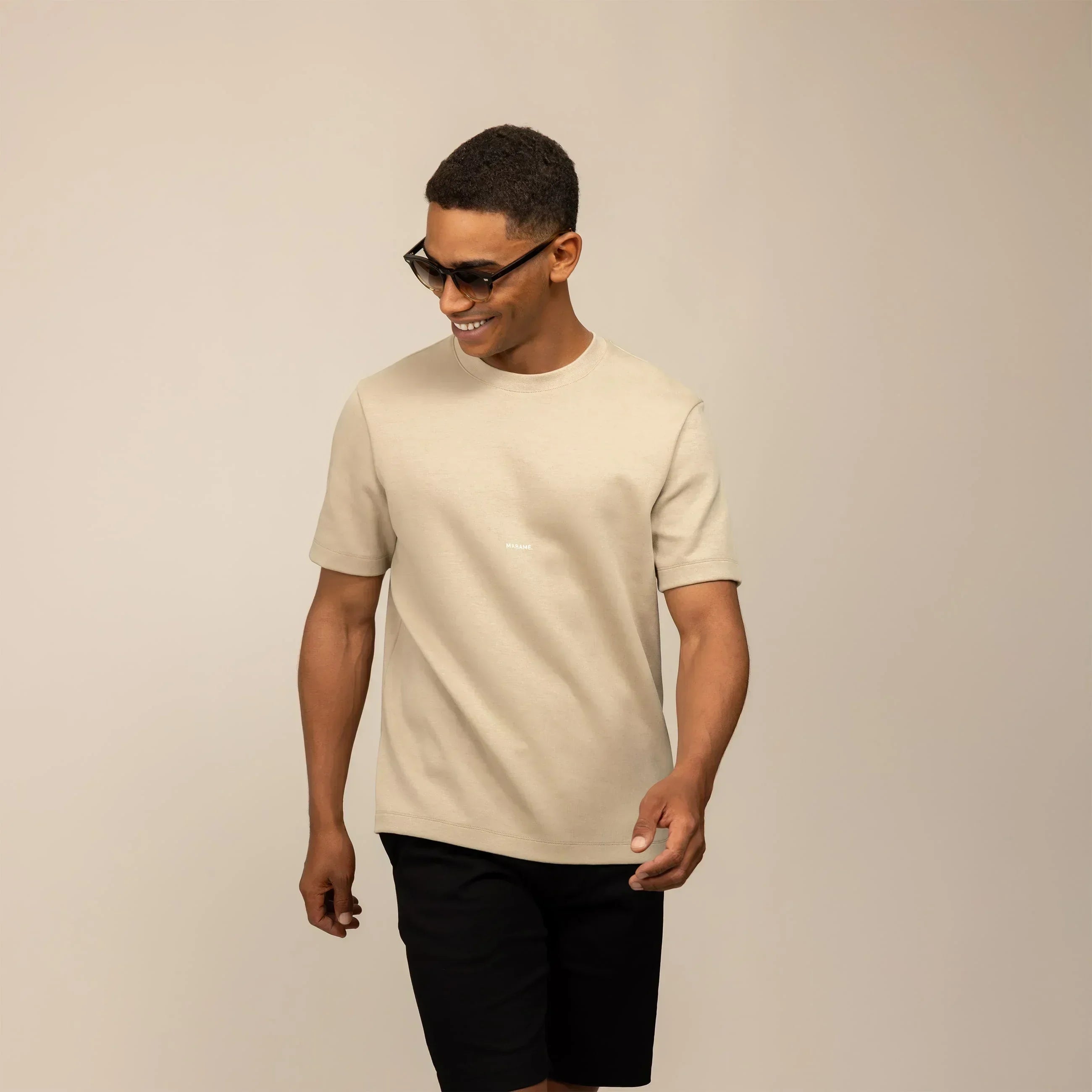 Man wearing a Marame Relaxed Fit Logo T-Shirt in Canyon Clay, front view.  |Canyon Clay