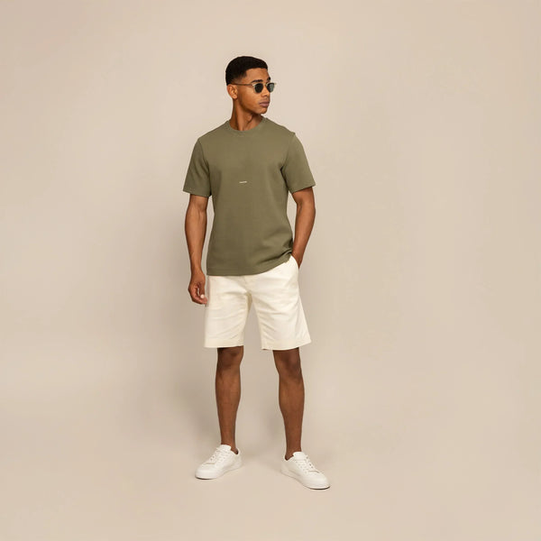 Man wearing a Marame Relaxed Fit Logo T-Shirt in Olive, front view.