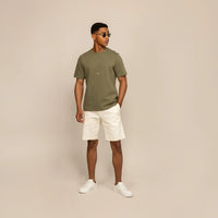 Man wearing a Marame Relaxed Fit Logo T-Shirt in Olive, front view.