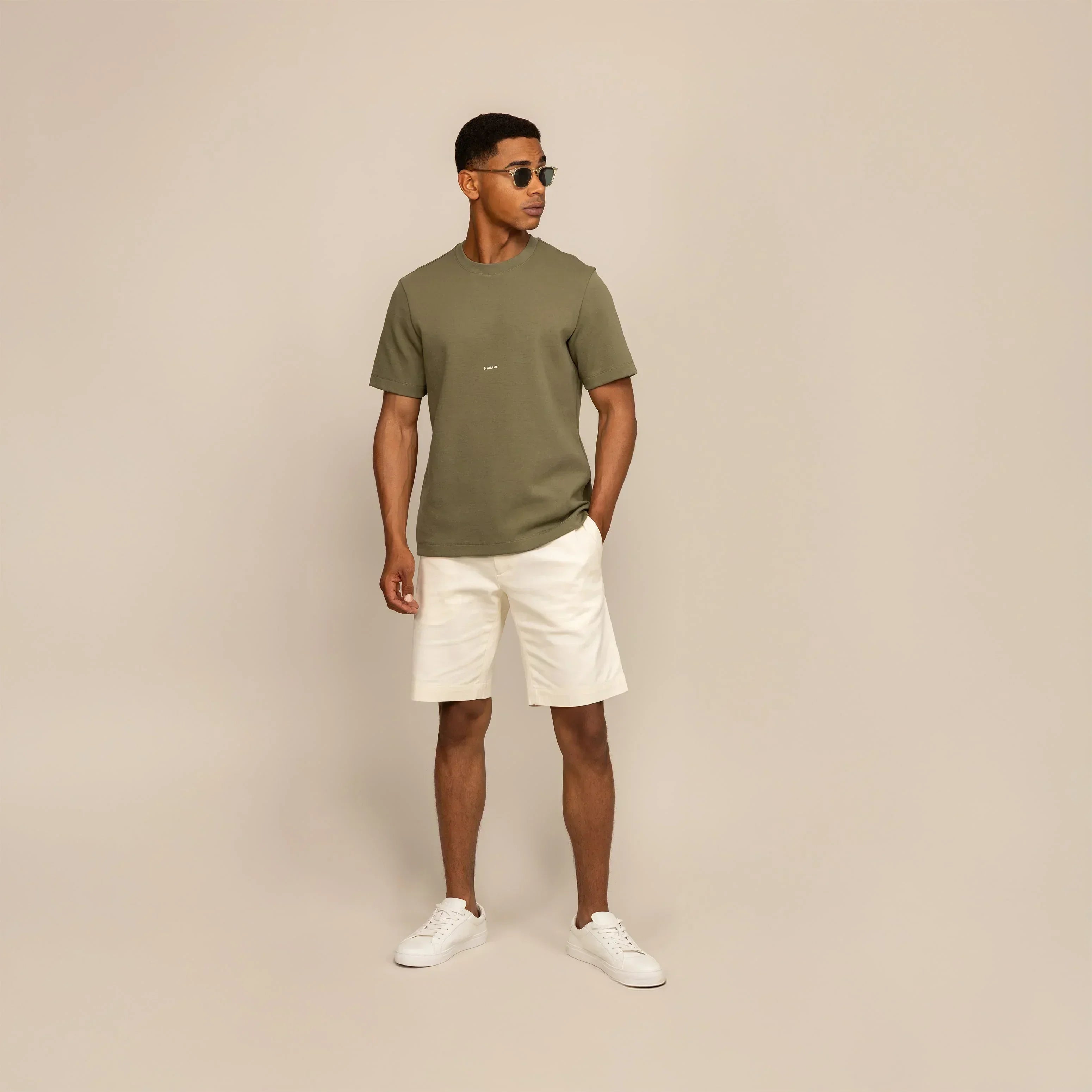 Man wearing a Marame Relaxed Fit Logo T-Shirt in Olive, front view. |Olive