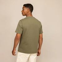 Man wearing a Marame Relaxed Fit Logo T-Shirt in Olive, rear view.
