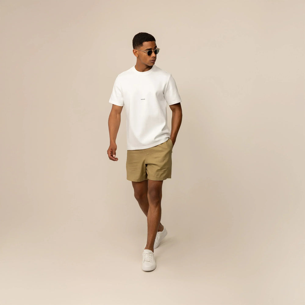 Man wearing a Marame Relaxed Fit Logo T-Shirt in White, front view.