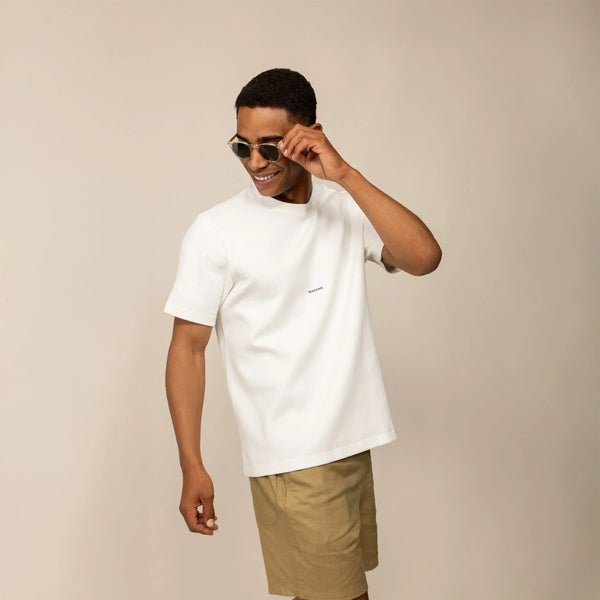 Man wearing a Marame Relaxed Fit Logo T-Shirt in White, front view.