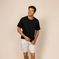 Man wearing a Marame Relaxed Fit T-Shirt in Black, front view.